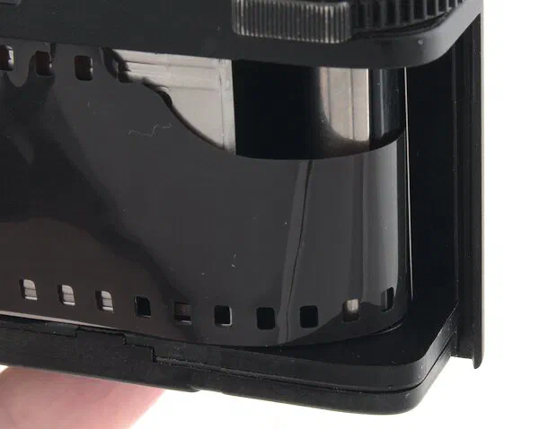 Film leader inserted in the Minox 35 EL take-up spool Film leader inserted in the Minox 35 EL take-up spool